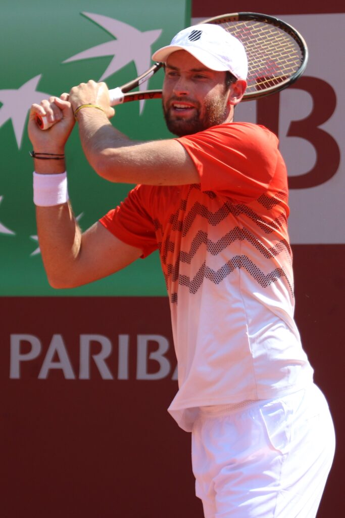 Iga Swiatek delivering an impressive serve during her third-round match at the French Open.
