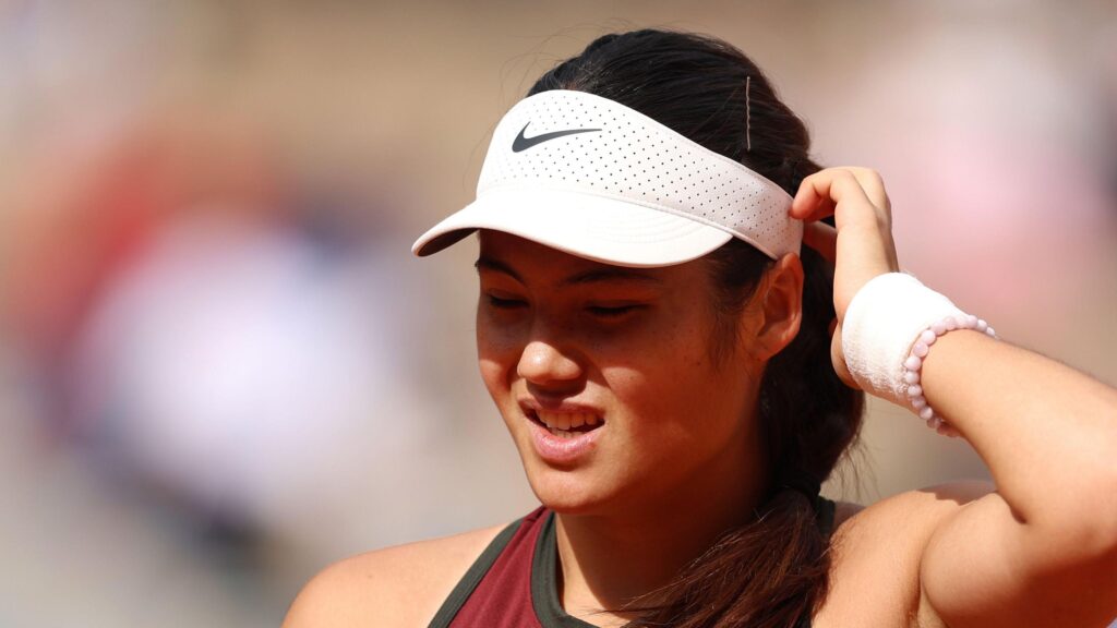 Iga Swiatek celebrates her victory over Jaqueline Cristian at the French Open, showcasing her skills at Roland-Garros.
