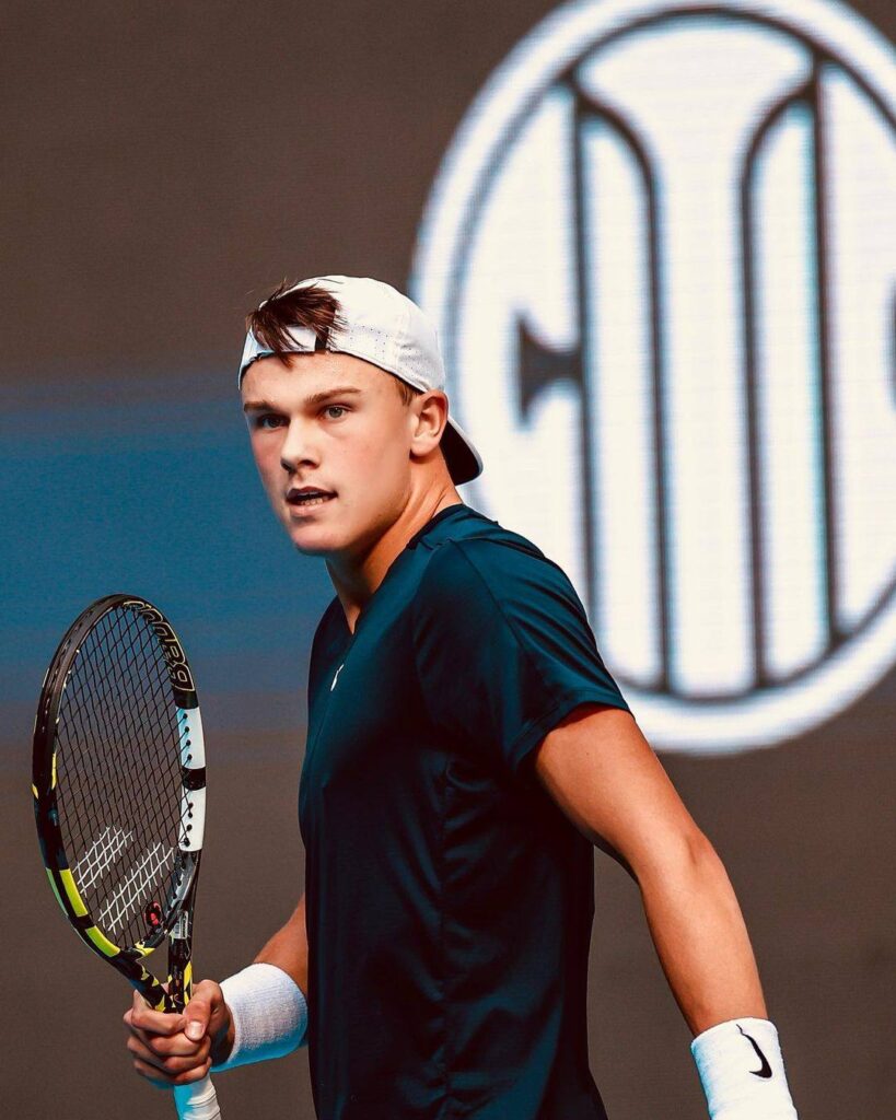 Holger Rune reacts during the French Open 2025 towel incident, showcasing his frustration amidst a tense match.