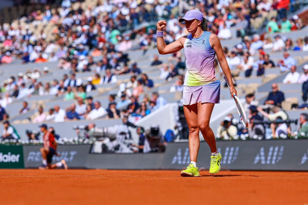 Iga Swiatek celebrates her fourth-round victory at Roland-Garros, showcasing her dominant clay-court skills.