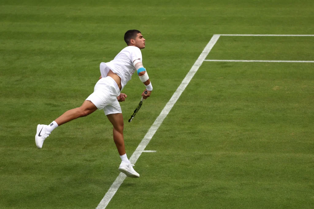 Damir Dzumhur and Carlos Alcaraz during a tense moment in their 2025 Roland Garros highlights match.