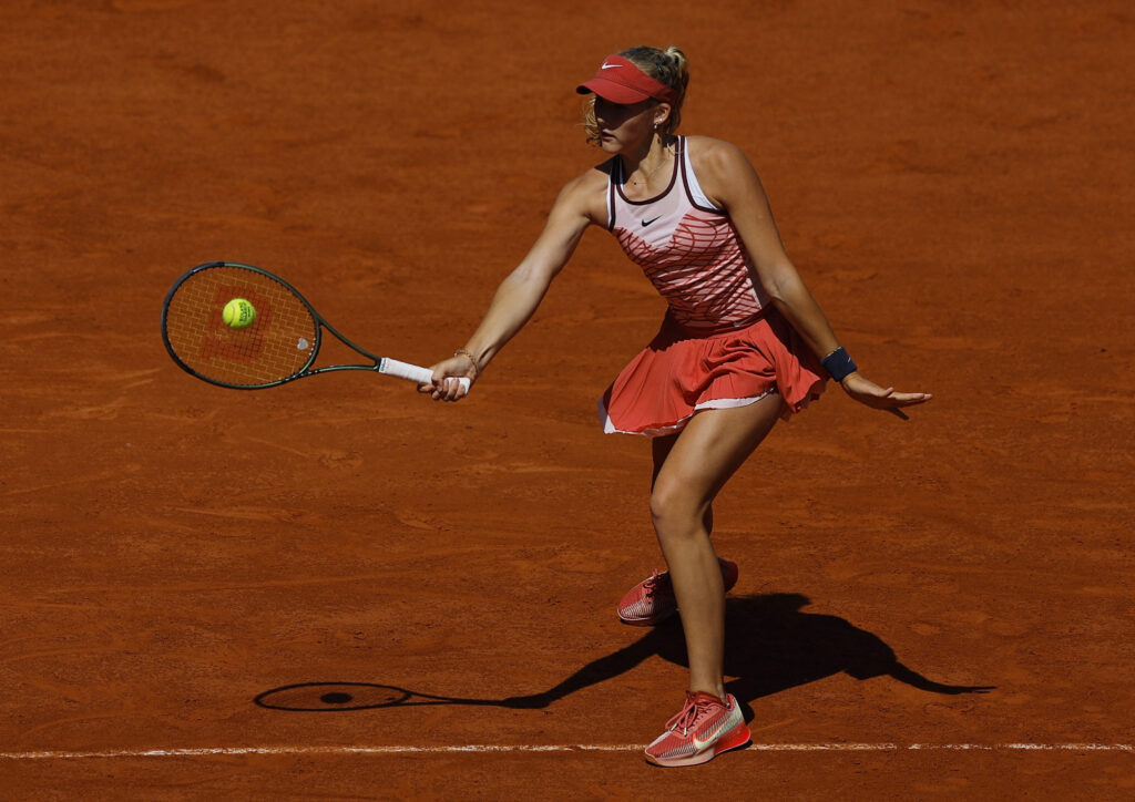 Mirra Andreeva celebrates her victory over Yulia Putintseva at Roland Garros 2023, advancing to the fourth round.