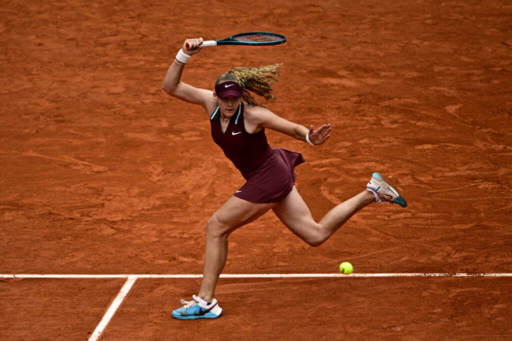 Mirra Andreeva and Yulia Putintseva competing in an intense match at Roland Garros, showcasing thrilling highlights.