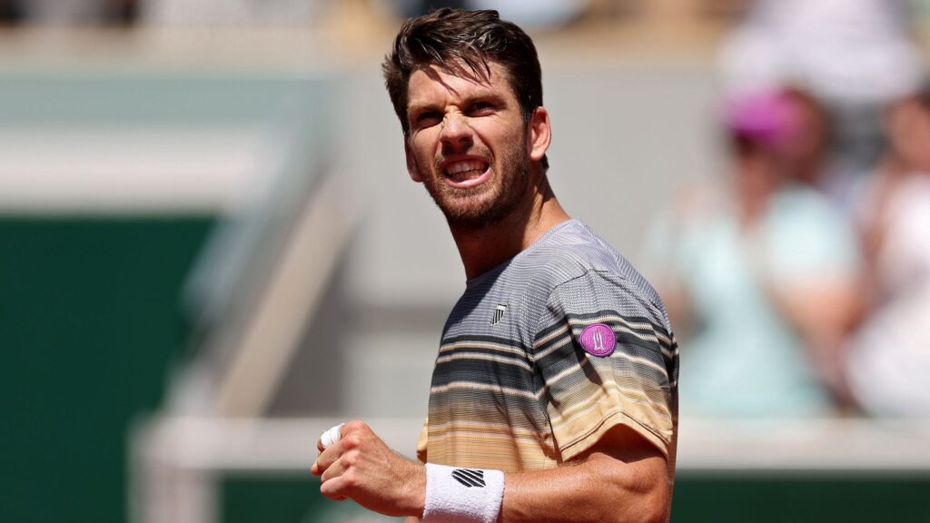 Cameron Norrie celebrates winning the opening point against Jacob Fearnley at the French Open.