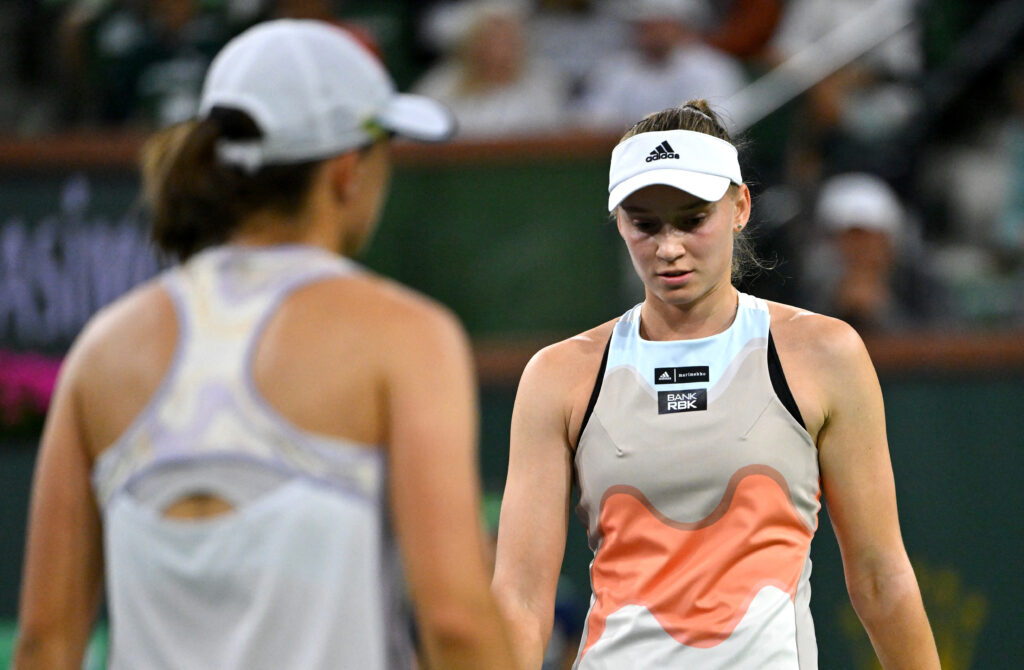 Iga Swiatek and Elena Rybakina compete on clay, highlighting their intense rivalry at Roland-Garros.