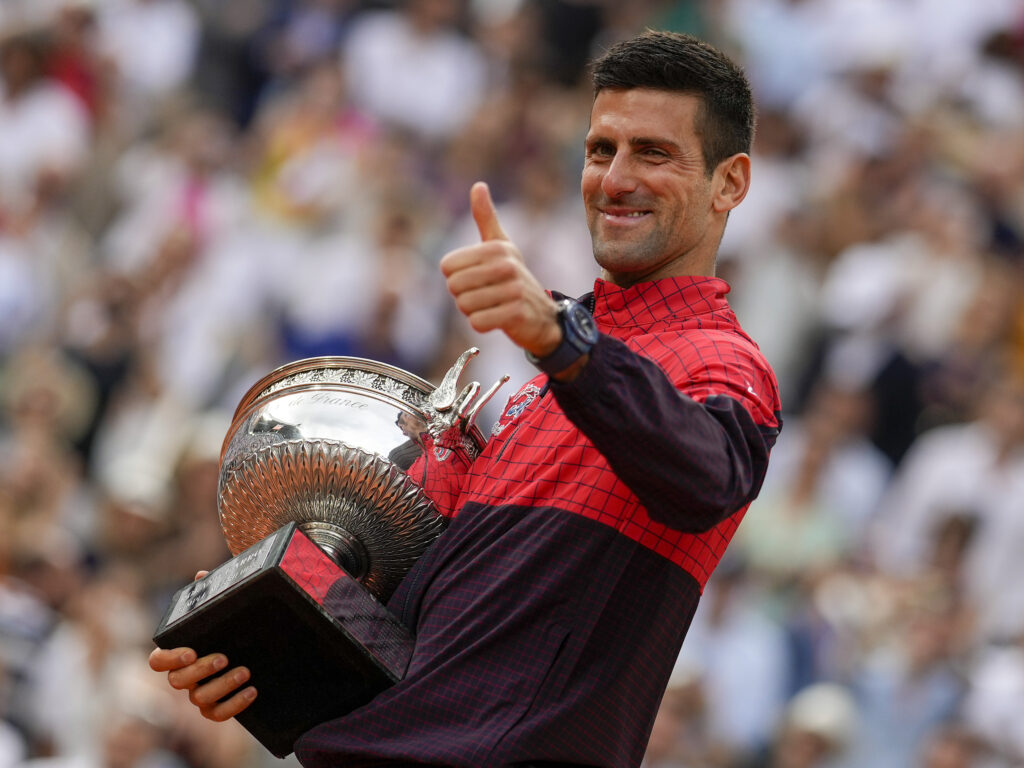 Novak Djokovic celebrates his victory at Roland Garros, matching his personal record of 99 match wins at the Grand Slam.