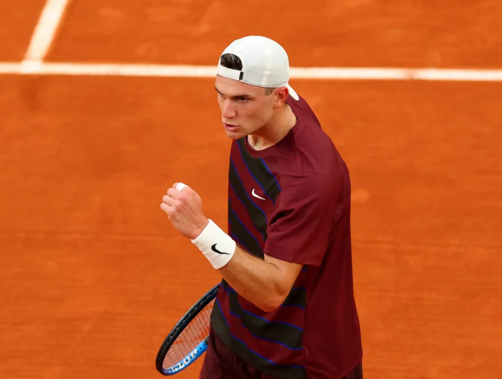 Jack Draper celebrates his victory over Gael Monfils at Roland Garros, advancing to face Joao Fonseca next.
