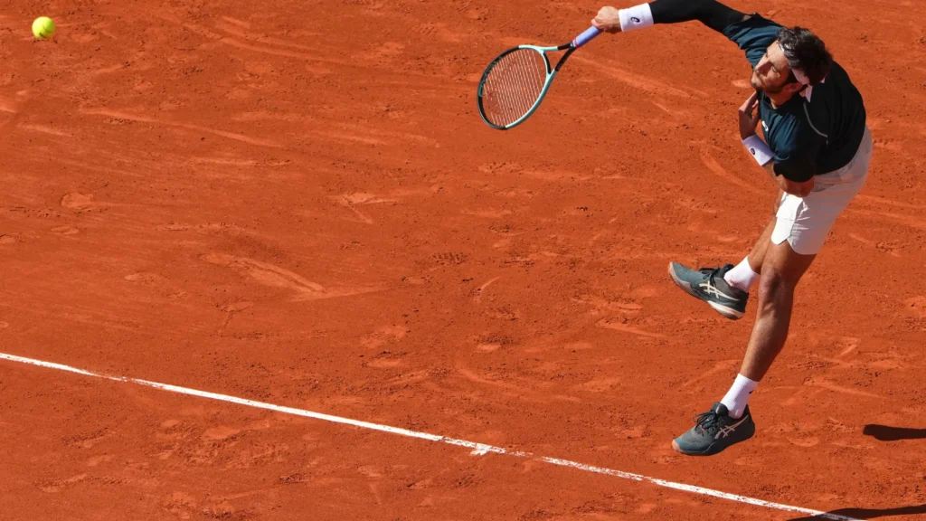 Lorenzo Musetti mishandles a drop shot during his match against Mariano Navone at the French Open.