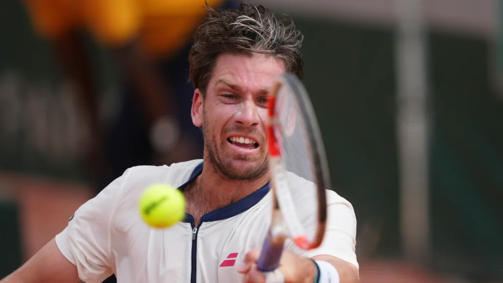 Cameron Norrie competes against Jacob Fearnley at the French Open, showcasing his strong performance on the court.