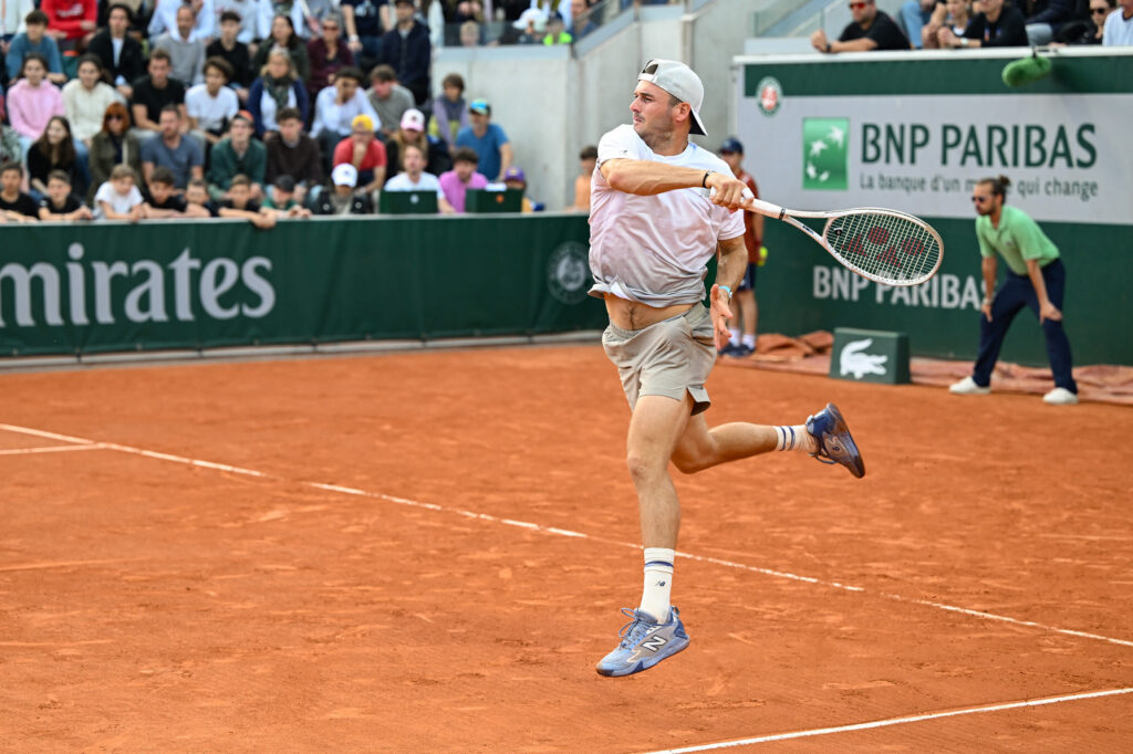 Tommy Paul celebrates his historic quarter-final win at Roland Garros, joining elite American tennis legends.