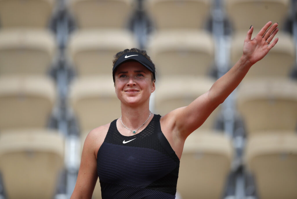 Elina Svitolina celebrates her stunning upset victory over Jasmine Paolini at the French Open.