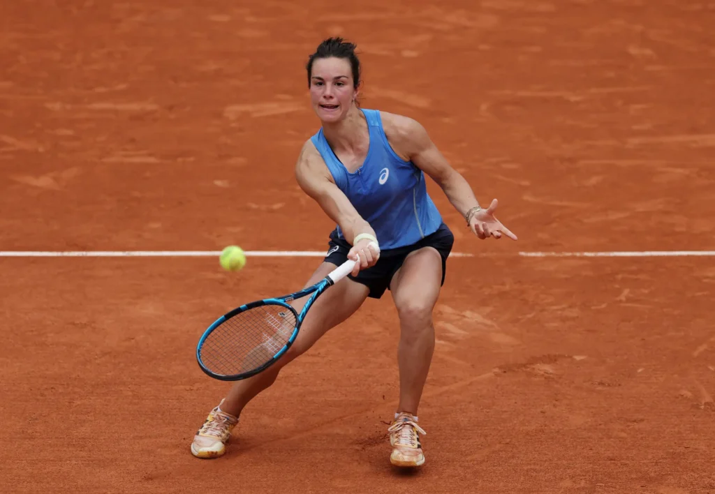 Lois Boisson celebrating her tennis comeback, showcasing resilience and determination at Roland-Garros.