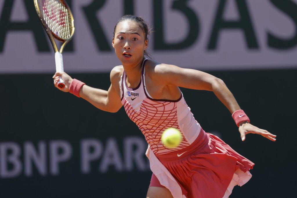 Zheng Qinwen celebrates her victory, advancing to the French Open quarterfinals after a tough match against Samsonova.