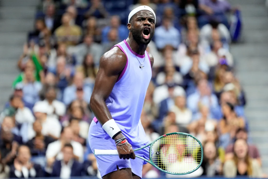 Frances Tiafoe celebrates his victory, advancing to the quarterfinals at the French Open against Daniel Altmaier.