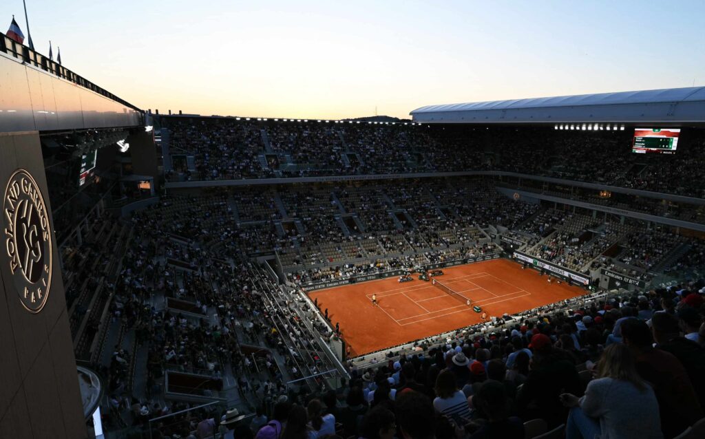 Roland Garros 2025 dates displayed prominently against a vibrant tennis court backdrop.