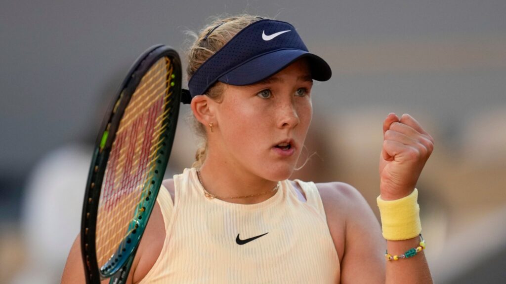 Mirra Andreeva celebrates her victory over Daria Kasatkina, advancing to the quarter-finals at Roland-Garros.