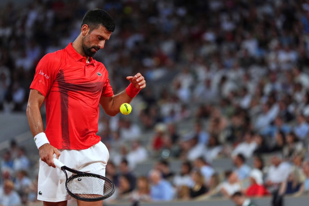 Novak Djokovic and Cameron Norrie wave to the crowd at the French Open, receiving enthusiastic ovations before their match.