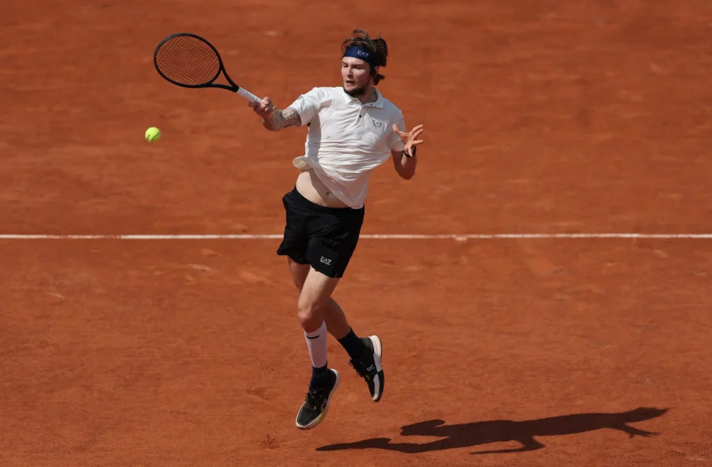 Alexander Bublik celebrates his French Open victory over Jack Draper, expressing joy and excitement after the match.