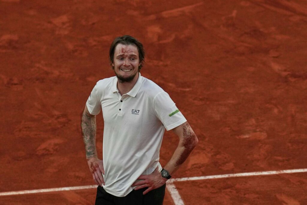 Alexander Bublik celebrating his victory at the French Open, showcasing his high-risk strategy against Jack Draper.