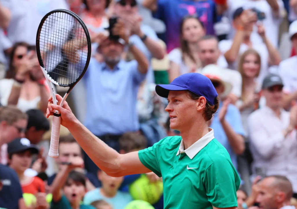 Jannik Sinner celebrates winning the first set against Andrey Rublev at the French Open.