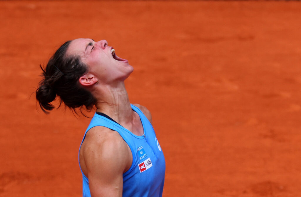 Lois Boisson celebrates her upset victory over Jessica Pegula at the French Open, advancing to the quarter-finals.