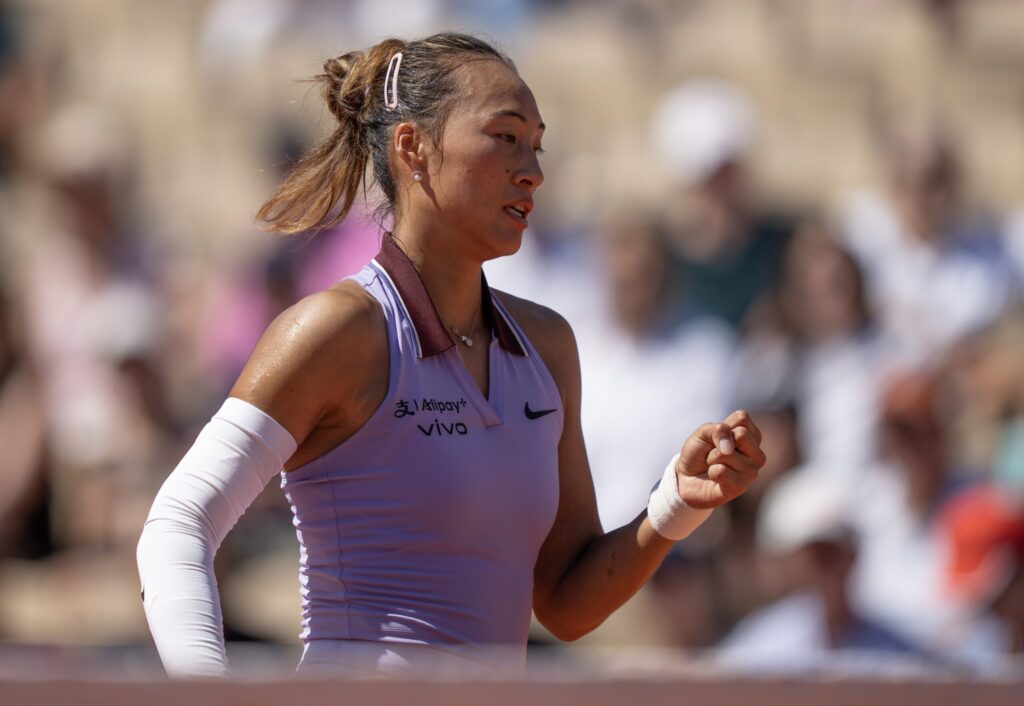 Qinwen Zheng executes a precise shot, hitting the line against Aryna Sabalenka at the French Open.