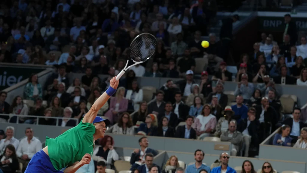 Jannik Sinner celebrates his straight-set victory over Andrey Rublev at Roland-Garros, showcasing his dominant performance.