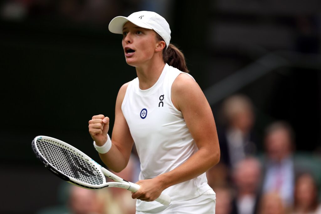 Iga Swiatek serves in her quarter-final match against Elina Svitolina at the French Open.
