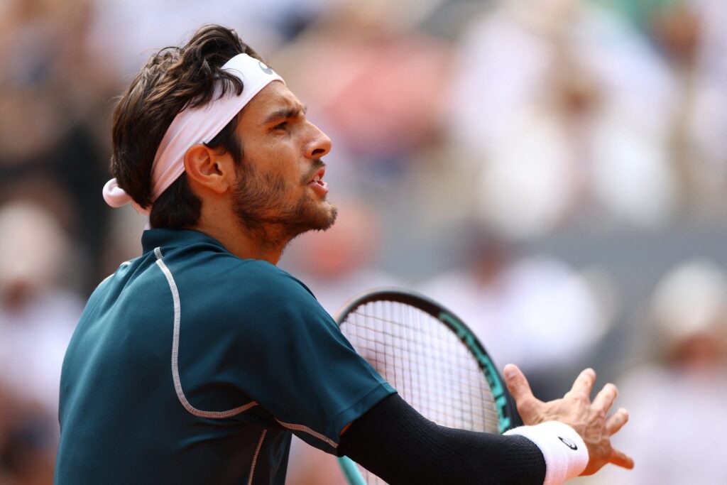 Lorenzo Musetti accidentally strikes a line judge with a ball during the 2025 French Open quarter-final match.