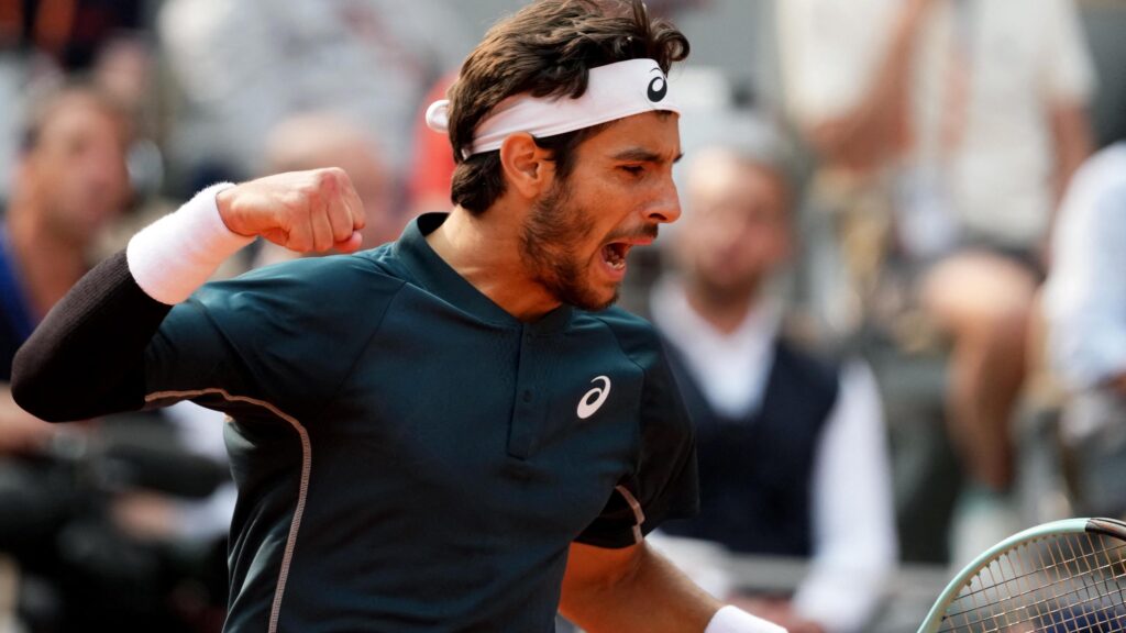 Lorenzo Musetti kicks a ball during the 2025 French Open, narrowly avoiding disqualification after striking a line judge.