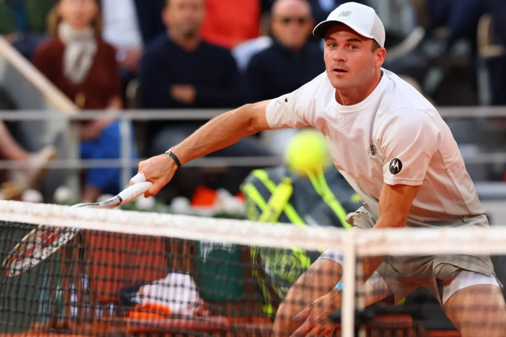 Carlos Alcaraz watches in amazement as Tommy Paul performs a stunning point at the French Open 2025.