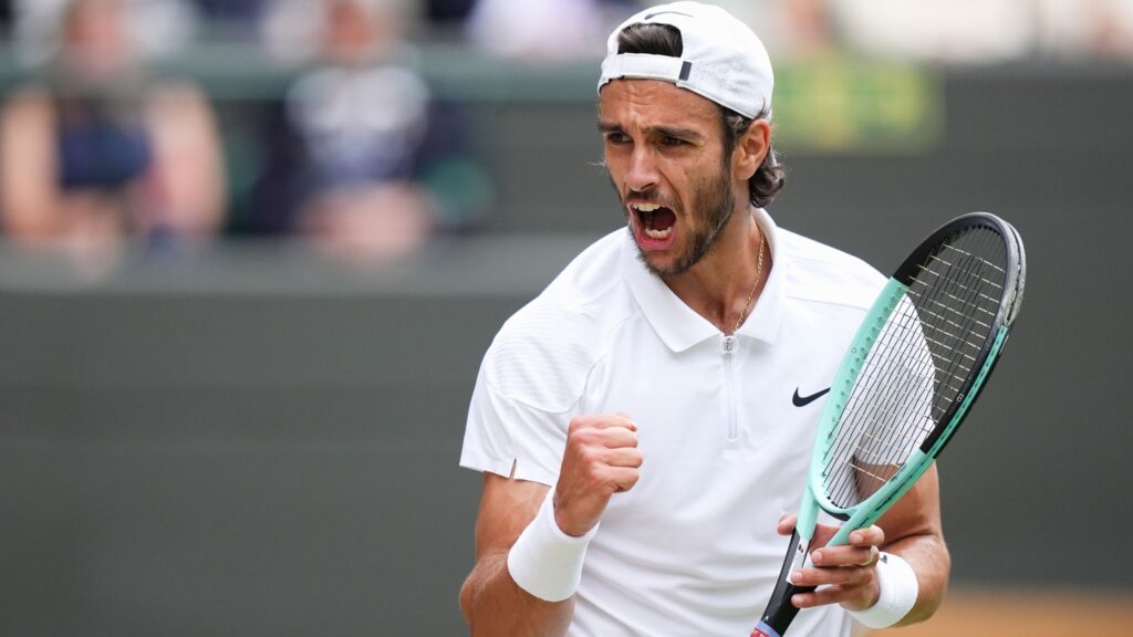 Lorenzo Musetti celebrates his victory over Frances Tiafoe, advancing to his first semi-final at Roland-Garros.