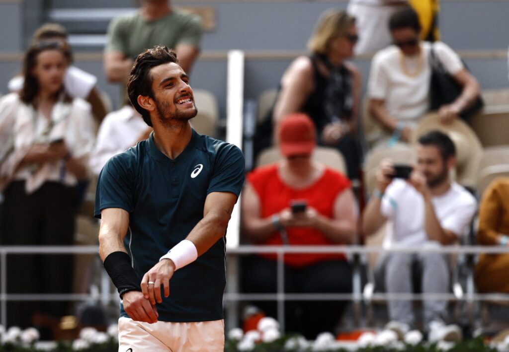 Lorenzo Musetti looks concerned on the court after the incident with a line judge at the French Open 2025.