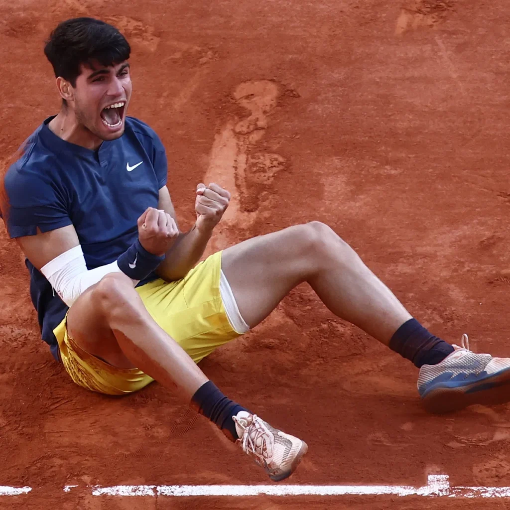 Carlos Alcaraz celebrates his quarter-final victory at the French Open, showcasing his dominant performance against Tommy Paul.
