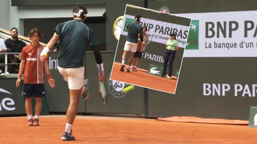 Lorenzo Musetti reacts after hitting a line judge with a ball during his French Open match against Frances Tiafoe.