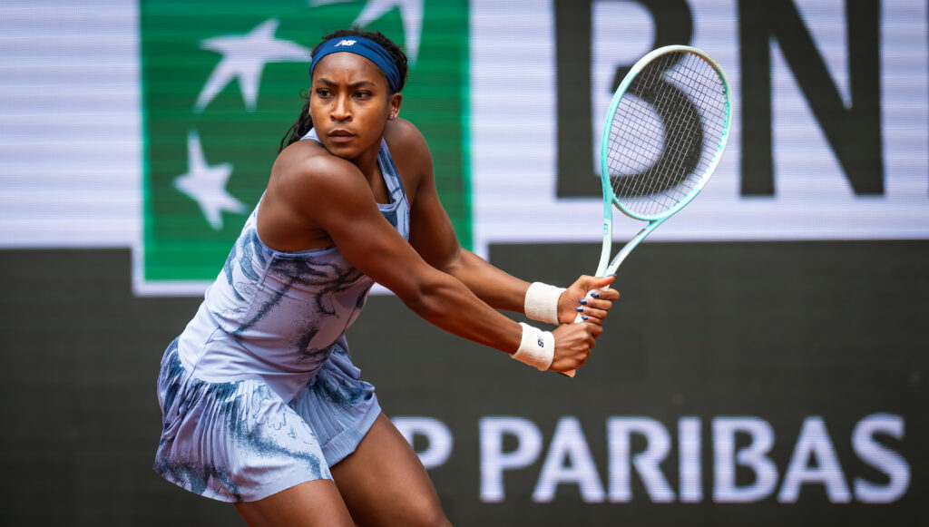 Coco Gauff celebrates her quarter-final win at Roland-Garros, showcasing her speed and determination on the clay courts.