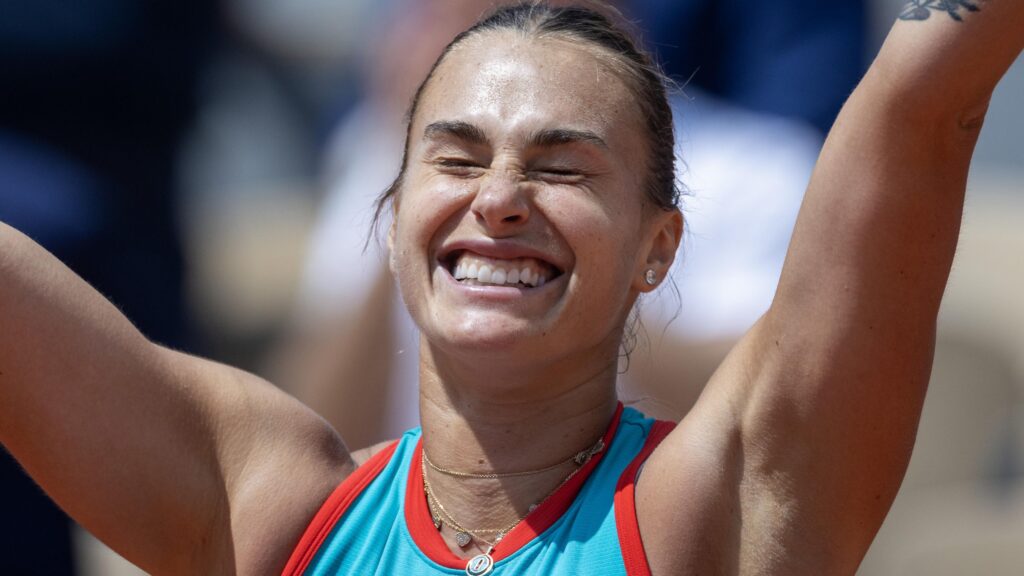 Aryna Sabalenka celebrates her victory over Iga Swiatek, advancing to her first Roland Garros final.