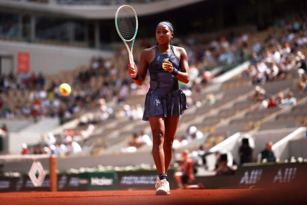 Coco Gauff celebrates her victory in the French Open semi-final against Lois Boisson.